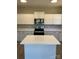 Bright kitchen with white cabinets, stainless steel appliances and a center island at 2037 Powerline Dr, Gastonia, NC 28054