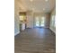 Open-concept living area featuring hardwood floors that connect the living space with the kitchen at 2037 Powerline Dr, Gastonia, NC 28054