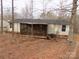 Backyard features a screened-in porch, perfect for relaxing and entertaining outdoors at 2130 Babbling Brook Ln, Gastonia, NC 28052