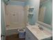 Bright bathroom with tub-shower combo, ample vanity space, and decorative shelving at 2130 Babbling Brook Ln, Gastonia, NC 28052