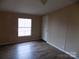 Bright bedroom with natural light, neutral walls, and modern flooring at 2130 Babbling Brook Ln, Gastonia, NC 28052
