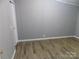 Bedroom features laminate flooring and neutral paint at 2130 Babbling Brook Ln, Gastonia, NC 28052