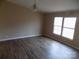 Bedroom featuring natural light, neutral walls, modern lighting, and updated flooring at 2130 Babbling Brook Ln, Gastonia, NC 28052