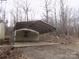 View of the carport, a practical addition providing covered parking and protection from the elements at 2130 Babbling Brook Ln, Gastonia, NC 28052