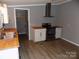 Modern kitchen featuring stainless steel appliances, wood counters, and hardwood floors at 2130 Babbling Brook Ln, Gastonia, NC 28052