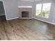 Bright living room with fireplace and newer flooring at 2130 Babbling Brook Ln, Gastonia, NC 28052