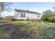 The backyard features a well-maintained lawn, a deck, and the home's exterior at 214 Harrel St, Salisbury, NC 28144