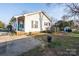 Cozy single-story home featuring a front porch, deck, and partially fenced backyard at 214 Harrel St, Salisbury, NC 28144