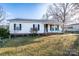 Charming one-story home with a cozy front porch and well-maintained lawn at 214 Harrel St, Salisbury, NC 28144