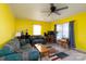 Comfortable living room with ample seating, a ceiling fan, and natural light at 214 Harrel St, Salisbury, NC 28144