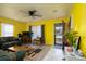 Cozy living space with a ceiling fan, TV, and warm, inviting decor at 214 Harrel St, Salisbury, NC 28144