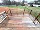 Spacious wooden back deck offers an inviting outdoor space to enjoy the serene backyard views at 2180 Grace Church Rd, Salisbury, NC 28147
