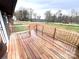 Spacious wooden back deck offers an inviting outdoor space to enjoy the serene backyard views at 2180 Grace Church Rd, Salisbury, NC 28147
