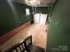 Spacious basement featuring concrete flooring, painted walls, stairs, and a garage door at 2180 Grace Church Rd, Salisbury, NC 28147
