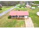 A single-story home featuring a metal roof, well-maintained yard, and attached garage at 2180 Grace Church Rd, Salisbury, NC 28147