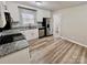 Modern kitchen featuring stainless steel appliances, gray granite countertops, and white cabinets at 2180 Grace Church Rd, Salisbury, NC 28147