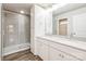 Modern bathroom featuring double sinks, a large mirror and a tiled glass-door shower at 2583 Watson Dr, Lancaster, SC 29720