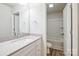 Well-lit bathroom with a single sink, and a combo shower/tub behind an open door at 2583 Watson Dr, Lancaster, SC 29720