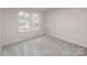 Cozy bedroom featuring neutral walls and carpet, bathed in natural light from large windows at 2583 Watson Dr, Lancaster, SC 29720