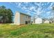 Expansive backyard with a well-maintained lawn, patio, and a detached garage at 2591 Watson Dr, Lancaster, SC 29720
