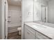 Well-lit bathroom with a single sink, a tub with a shower, and a modern white vanity at 2591 Watson Dr, Lancaster, SC 29720