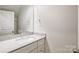 Bright bathroom featuring a modern vanity with a stone countertop, a large mirror, and stylish fixtures at 2591 Watson Dr, Lancaster, SC 29720