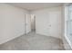 Bright bedroom with two doors, neutral carpeting, and white walls for versatile decorating at 2591 Watson Dr, Lancaster, SC 29720