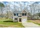 Charming two-story home featuring a well-manicured lawn and a single-car garage, all in a peaceful, wooded setting at 2591 Watson Dr, Lancaster, SC 29720
