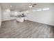 Modern kitchen featuring stainless steel appliances, white cabinets, granite countertops, and hardwood flooring at 2591 Watson Dr, Lancaster, SC 29720