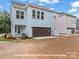 Home exterior featuring a brick driveway and a two-car garage at 276 Gilead Rd, Huntersville, NC 28078