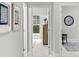 Bright hallway with neutral carpet, framed art, and views into adjacent rooms at 276 Gilead Rd, Huntersville, NC 28078