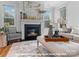 Inviting living room featuring fireplace, large windows, and neutral-toned furnishings at 276 Gilead Rd, Huntersville, NC 28078