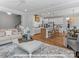 Open-concept living space with kitchen island, hardwood floors, and ample seating at 276 Gilead Rd, Huntersville, NC 28078