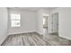 Bright bedroom with modern flooring, window and light walls at 2822 Woodlands Creek Dr, Monroe, NC 28110