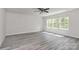 Spacious bedroom with a ceiling fan and lots of natural light from the large windows at 2822 Woodlands Creek Dr, Monroe, NC 28110