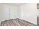 Bedroom featuring modern flooring, closet doors, and light gray walls at 2822 Woodlands Creek Dr, Monroe, NC 28110