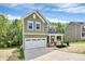 Charming home with an attached two-car garage and covered front porch at 2822 Woodlands Creek Dr, Monroe, NC 28110