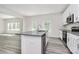 Kitchen featuring granite countertops, stainless steel appliances, and an island with sink at 2822 Woodlands Creek Dr, Monroe, NC 28110