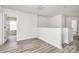 Open loft area with modern flooring and neutral paint, ideal for flexible living at 2822 Woodlands Creek Dr, Monroe, NC 28110