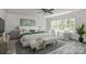 Serene main bedroom with lots of natural light, stylish decor, and a ceiling fan at 2822 Woodlands Creek Dr, Monroe, NC 28110