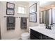 Charming bathroom with modern vanity, decorative art, and ample lighting at 3614 Dolly Madison Rd, Charlotte, NC 28208