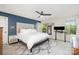 Bedroom with ceiling fan, stylish decor, and natural light from the window at 3614 Dolly Madison Rd, Charlotte, NC 28208