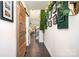 Inviting hallway features dark wood floors, a barn door, and decorative plants at 3614 Dolly Madison Rd, Charlotte, NC 28208