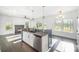 Bright kitchen with granite countertops, stainless steel appliances, and dark wood flooring at 3614 Dolly Madison Rd, Charlotte, NC 28208