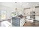 Bright kitchen featuring granite countertops, stainless steel appliances, a breakfast nook and dark wood flooring at 3614 Dolly Madison Rd, Charlotte, NC 28208