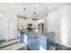 A kitchen features granite countertops, stainless steel appliances, white cabinets, and dark wood flooring at 3614 Dolly Madison Rd, Charlotte, NC 28208