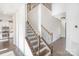 Beautiful staircase with wood and iron railings with a view to the kitchen at 3614 Dolly Madison Rd, Charlotte, NC 28208