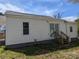 Exterior view of the back of the house showing the siding and back entrance at 3703 Crawford St, Gastonia, NC 28052