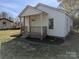 Charming single-story home with a cozy front porch, fresh landscaping, and recently painted exterior at 3703 Crawford St, Gastonia, NC 28052