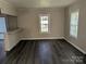Bright living room featuring sleek floors, neutral paint, and natural light streaming through the window at 3703 Crawford St, Gastonia, NC 28052